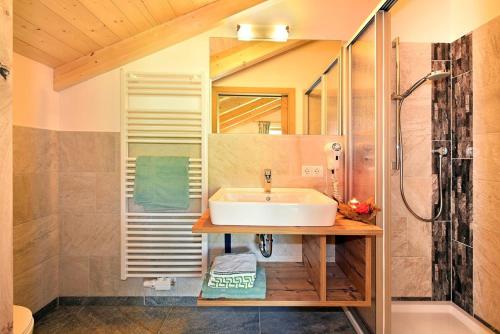 a bathroom with a sink and a shower at Planatschhof in Villnoss