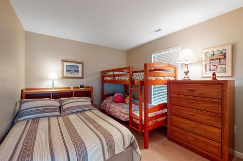 a bedroom with a bunk bed and a dresser at South Hampton --- 37923 Greenwich Ln in Ocean View