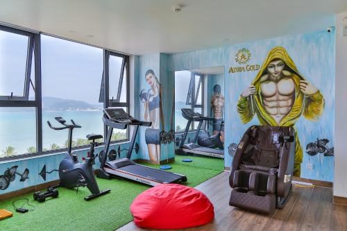 a gym with a painting of a man on the wall at Azura Gold Hotel & Apartment in Nha Trang
