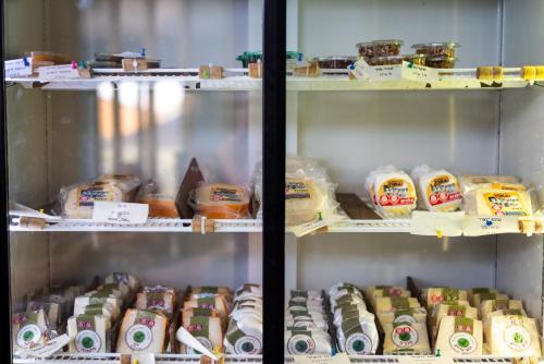 a refrigerator filled with lots of different types of food at Carmey Avdat Farm in Midreshet Ben Gurion