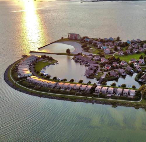 an aerial view of a resort on an island in the water at Beach Resort Makkum in Makkum