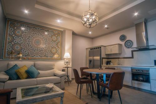 a living room with a couch and a table at Apartamentos Turísticos La Baílla in Rota