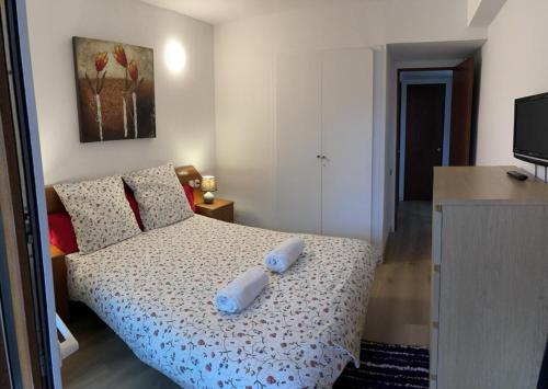 a bedroom with a bed with two pillows on it at Nice apartment Soldeu Renttarter in Soldeu