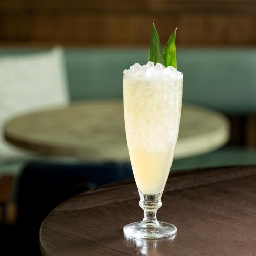 a drink in a glass sitting on a table at Kimpton Gray Hotel Chicago by IHG in Chicago