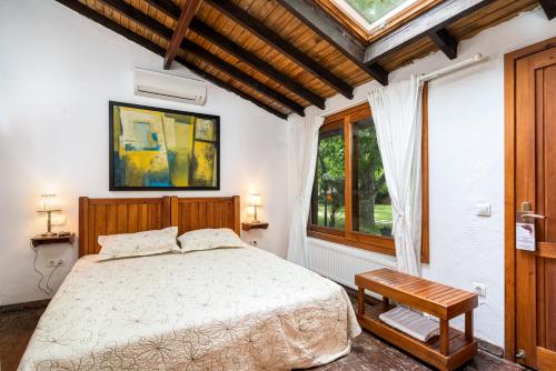 Ένα ή περισσότερα κρεβάτια σε δωμάτιο στο Ephesus Lodge