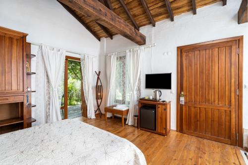 Ένα ή περισσότερα κρεβάτια σε δωμάτιο στο Ephesus Lodge