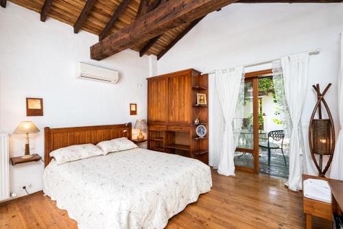 Ένα ή περισσότερα κρεβάτια σε δωμάτιο στο Ephesus Lodge