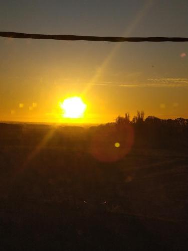 Lever ou coucher de soleil vu de la maison de vacances ou à proximité