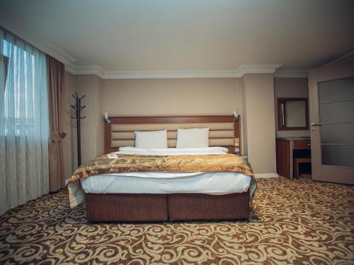 Postel nebo postele na pokoji v ubytování Balturk Hotel Sakarya