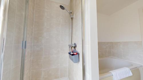 a bathroom with a shower and a tub and a shower at Sparrowbill House by Cliftonvalley Apartments in Bristol