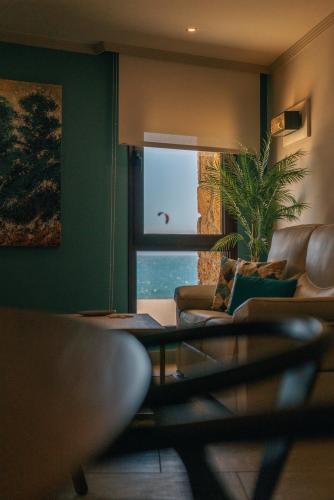 a living room with a couch and a window at Apartamentos Turísticos La Baílla in Rota