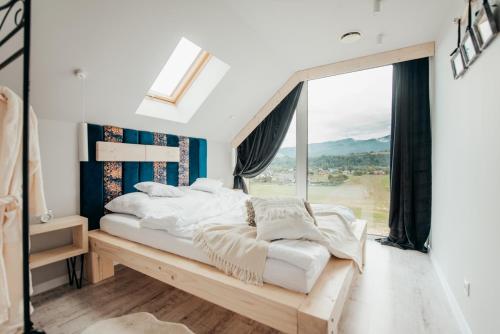 Posteľ alebo postele v izbe v ubytovaní Dream Hill - Dom Premium z jacuzzi oraz sauną w cenie i na wyłączność