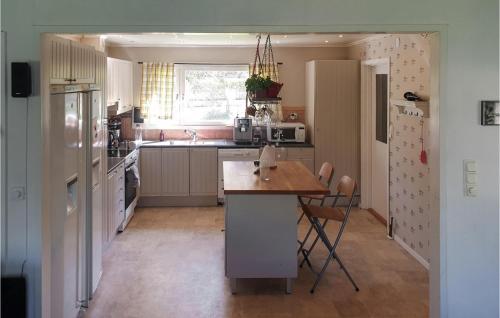 a kitchen with a island in the middle of it at 4 Bedroom Nice Home In Trosa in Trosa