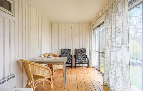 a dining room with a table and chairs at Beautiful Home In Hyltebruk With Wifi in Hyltebruk