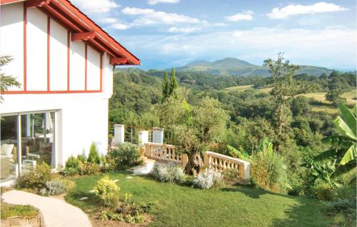 a house with a view of the mountains at Lovely Home In Saint-Pée-Sur-Nivelle in Saint-Pée-sur-Nivelle