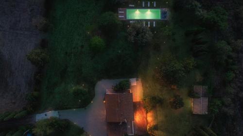 an overhead view of a house in the forest at night at CASALE DELL'OASI 12, Emma Villas in Gallese