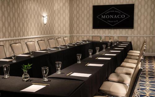 a row of tables and chairs in a room at Kimpton Hotel Monaco Seattle by IHG in Seattle