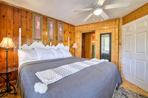 a bedroom with a bed and a ceiling fan at Dancing Waters in Lake Lure