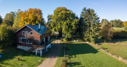 an aerial view of a house in a field at Le Milan Royal 26 pers, Malmedy, Balnéo, vue, calme in Malmedy