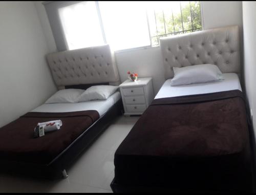 Una cama o camas en una habitación de buenavista class