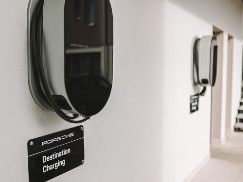 a mirror hanging on a wall with a sign on it at Hotel Leone in Međugorje