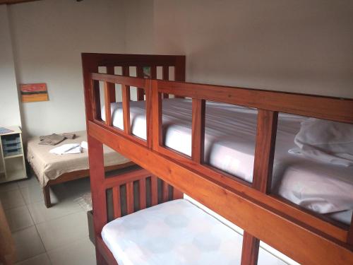 a pair of bunk beds in a room at Apts centro Ubatuba in Ubatuba