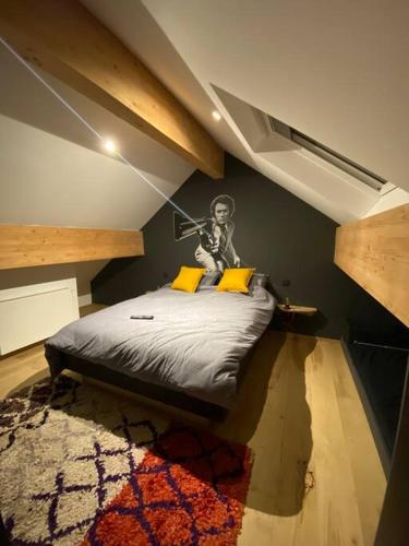 a bedroom with a bed with a skeleton on the wall at Maison de vacances la Grange 20 min de namur in Villeret