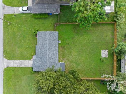 an aerial view of a yard with a building at Charming & Renovated Home 20 Minutes from Tampa in Brandon