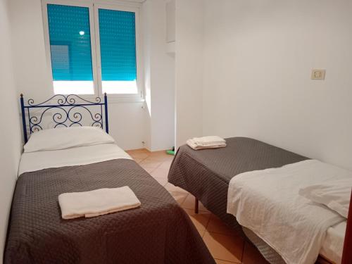Postel nebo postele na pokoji v ubytování San Pietro Holiday Apartment