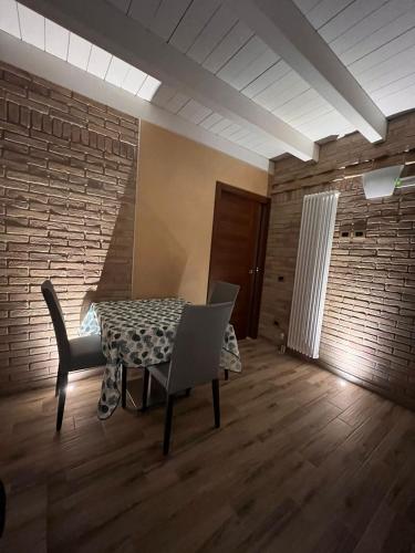 a dining room with a table and chairs at Antica Locanda Zio Cesare in Ferrara