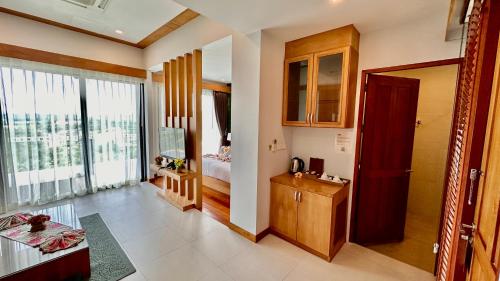 a living room with a room with a bedroom at Aonang Phu Dahla Private Pool & Sea View - SHA Plus in Ao Nang Beach
