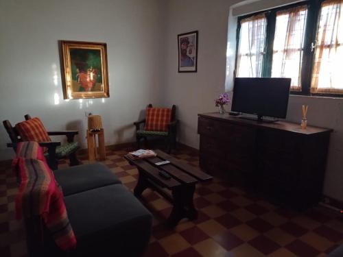 TV a/nebo společenská místnost v ubytování Inti Raymi