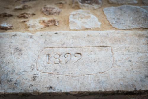 a stone slab with the number on it at Borgo Monachella in Ragusa