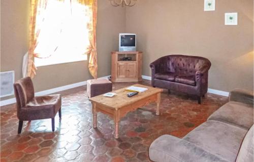 a living room with a couch and chairs and a table at Nice Home In Vaudoy-En-Brie With Wifi in Vaudoy-en-Brie