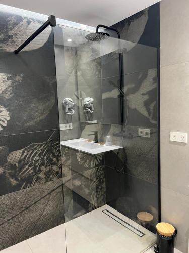a bathroom with a shower with a sink at GRAN COLL BLANC Confort in Pas de la Casa