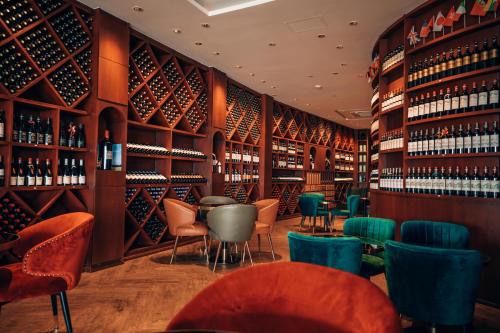 a bar with a lot of wine bottles at La Seine Hotel in Vientiane