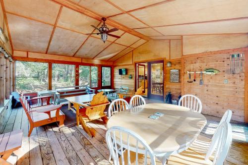 a dining room with a table and chairs at Absolute Leelanau in Glen Arbor