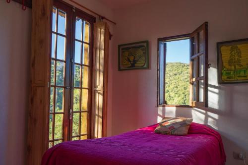 Ένα ή περισσότερα κρεβάτια σε δωμάτιο στο Casa de campo, en la reserva de La Quebrada