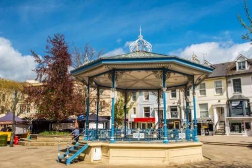 a blue gazebo with a person in it at KB51 Charming 2 bed house in Horsham, pets very welcome and long stays with easy access to London, Brighton and Gatwick in Warnham