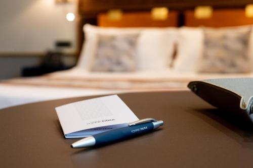 a blue pen sitting on top of a table at Grand Hotel Torre Fara in Chiavari