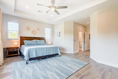 a bedroom with a bed and a ceiling fan at Sea Flamingo in Cape Canaveral