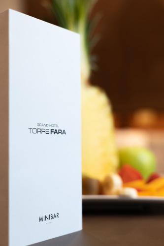 a white sign sitting on top of a table at Grand Hotel Torre Fara in Chiavari