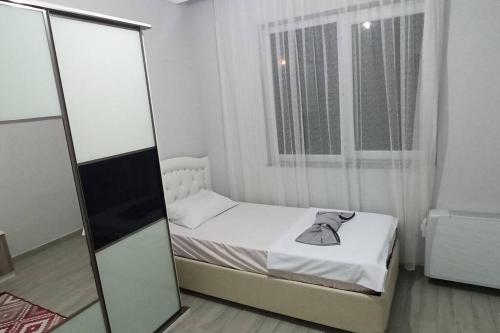 Säng eller sängar i ett rum på Villa ArasyA