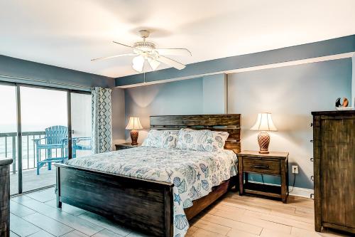 a bedroom with a bed and a ceiling fan at x Sea Marsh II 503 in Myrtle Beach