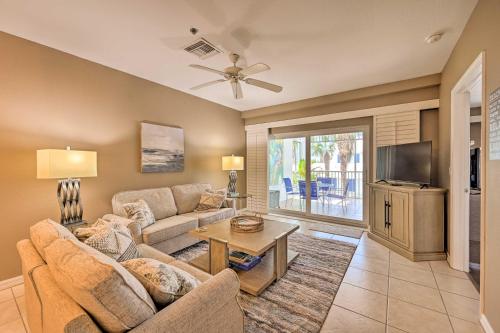a living room with a couch and a tv at Marco Island Condo with Shared Pool and Hot Tub! in Marco Island