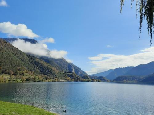 a view of a lake with mountains in the background at La mansarda di Rossella in Pieve Di Ledro