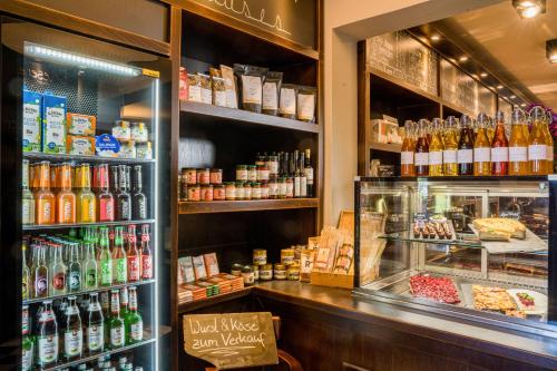 a store filled with lots of different types of drinks at QUARTIER 5 Hotel & Restaurant, Sächsische Schweiz in Kurort Gohrisch