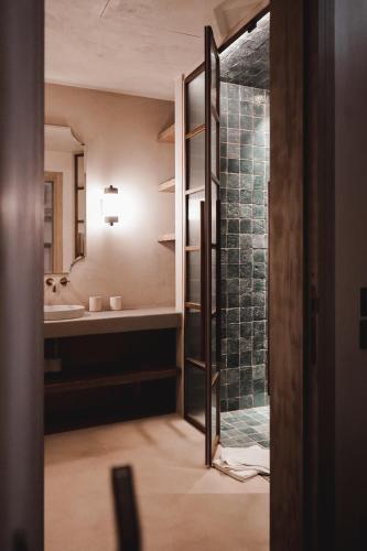 a bathroom with a shower and a sink at Vocabolo Moscatelli in Calzolaro