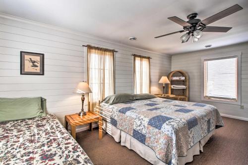 a bedroom with two beds and a ceiling fan at Remote Retreat Cozy Home with Big Pine Lake Access! in Perham