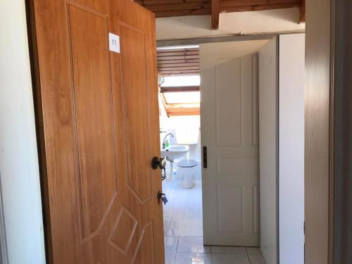 an open door in a room with a hallway at Ion Apartments Messolonghi Single Bed Room Mountain View Loft in Mesolongion